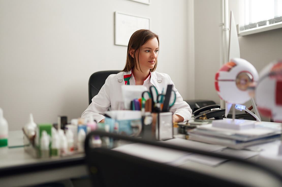 Doctor working in her office