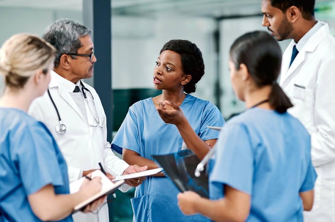 Shot of a group of medical practitioners having a discussion in a hospital