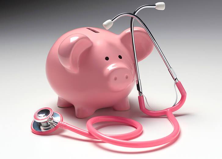 Piggy bank and stethoscope illustrating medical insurance