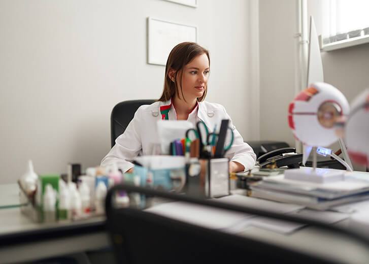 Doctor working in her office